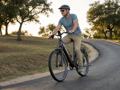 Man riding a black Dukawey FUGL Pro on a park road
